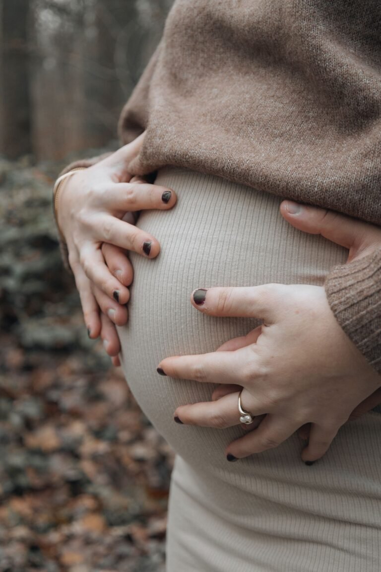 Hands on pregnant belly - Infertility Banjhpan Ayurvedic Upchar Jaipur