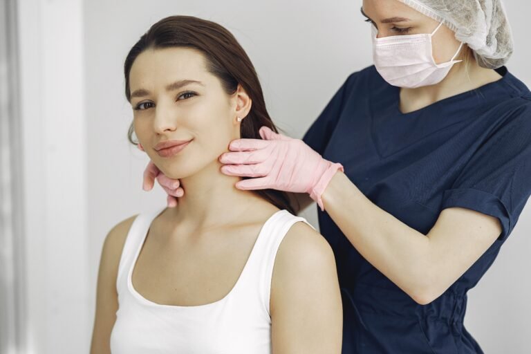 Medical practitioner performing neck and thyroid examination - Ayurvedic thyroid treatment in Jaipur