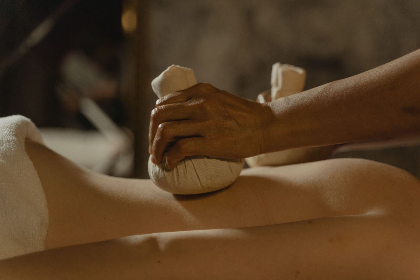 Traditional herbal compress massage therapy used in Panchkarma treatment - Ayurvedic Panchkarma treatment in Jaipur