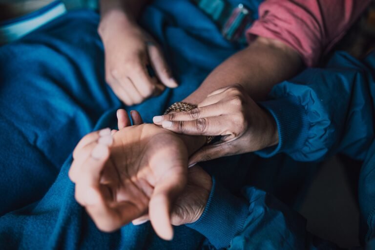 Ayurvedic doctor checking patient pulse for Vikriti assessment and dosha imbalance diagnosis - Ayurvedic treatment in Jaipur