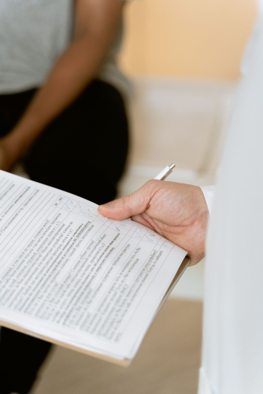 Ayurvedic doctor reviewing patient health chart during Prakriti assessment consultation - Ayurvedic treatment in Jaipur