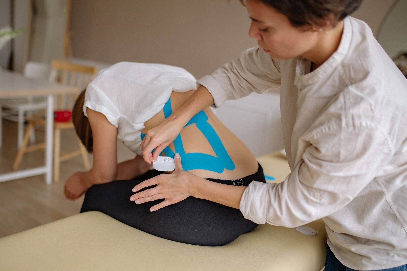 Woman receiving medical treatment - Hrud Basti Ayurvedic Chest Therapy Jaipur