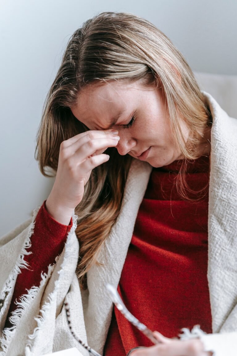 Woman experiencing migraine headache relief through Ayurvedic treatment in Jaipur
