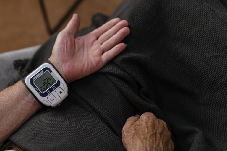 Senior adult checking blood pressure at home for hypotension - low blood pressure Ayurvedic treatment in Jaipur